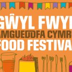 Poster with images of food and text: "GWYL FWYD AMGUEDDFA CYMRU FOOD FESTIVAL"